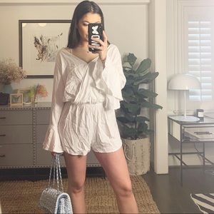 indah white romper with bell sleeves